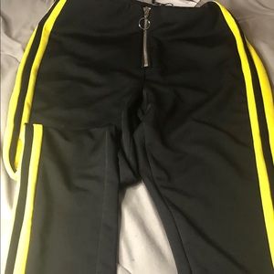 Black pants with yellow side stripe
